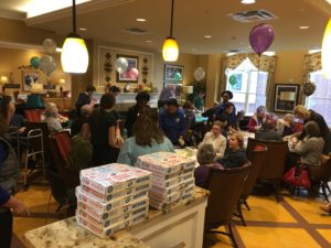 Wide angle of Still Significant Martha's Table Event with pizza party