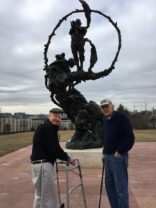 Kensington Falls Church residents stop in front of african american heritage statue
