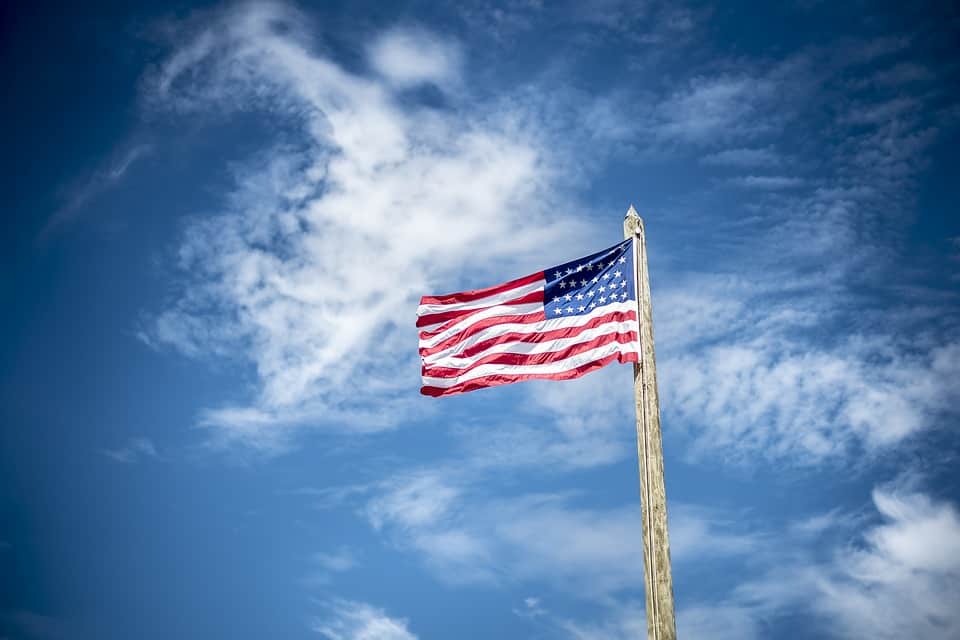 American Flag against blue sky on Flag Day.