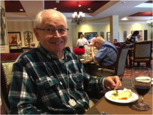 Harold P enjoying dessert in The Kensington Falls Church's dining room.