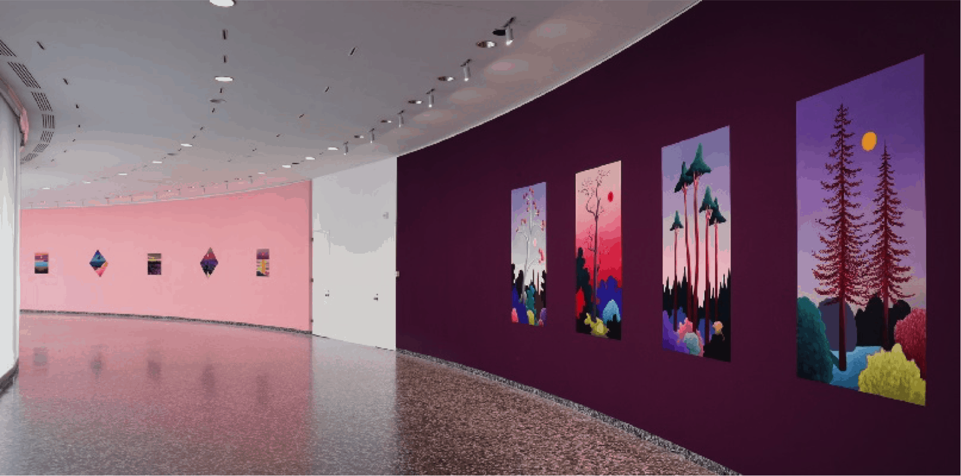 An empty pink and maroon hall at the Hirshorn Museum with art hung on the walls
