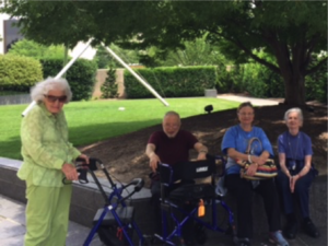 A group of Kensington Falls Church Residents enjoying a shady spot at the Hirshhorn Sculpture Garden.