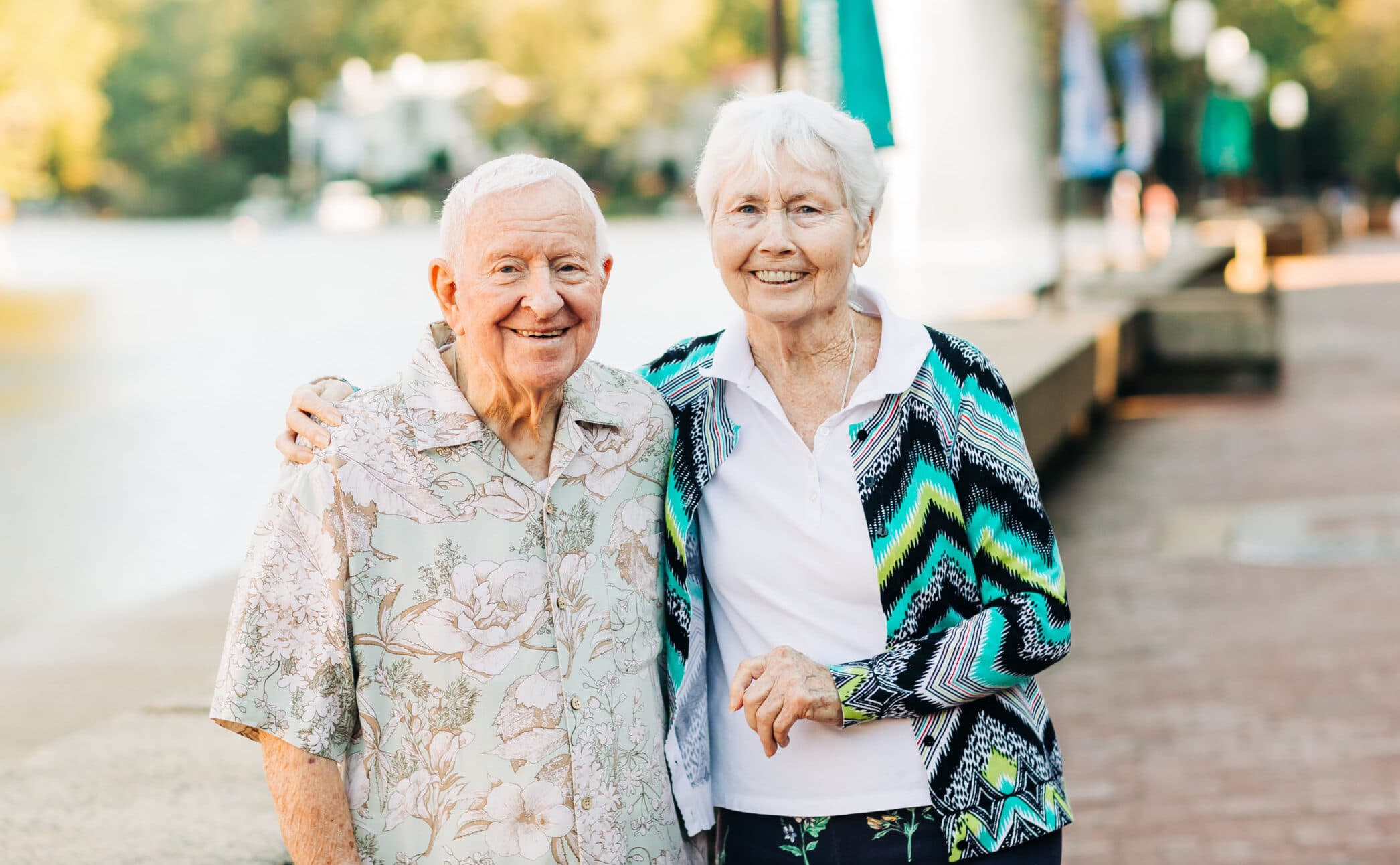 senior couple by the water outside