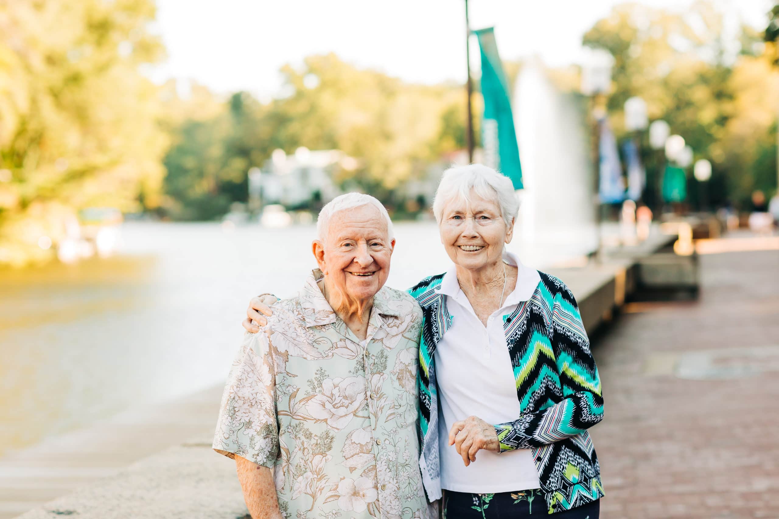 senior couple by the water outside