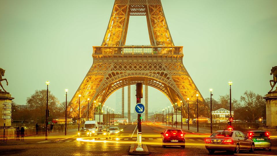 Twilight on the road under the Eiffel Tower.