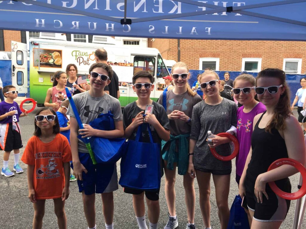 Kids enjoying The Kensington Booth at Memorial Day Parade in Falls Church Virginia