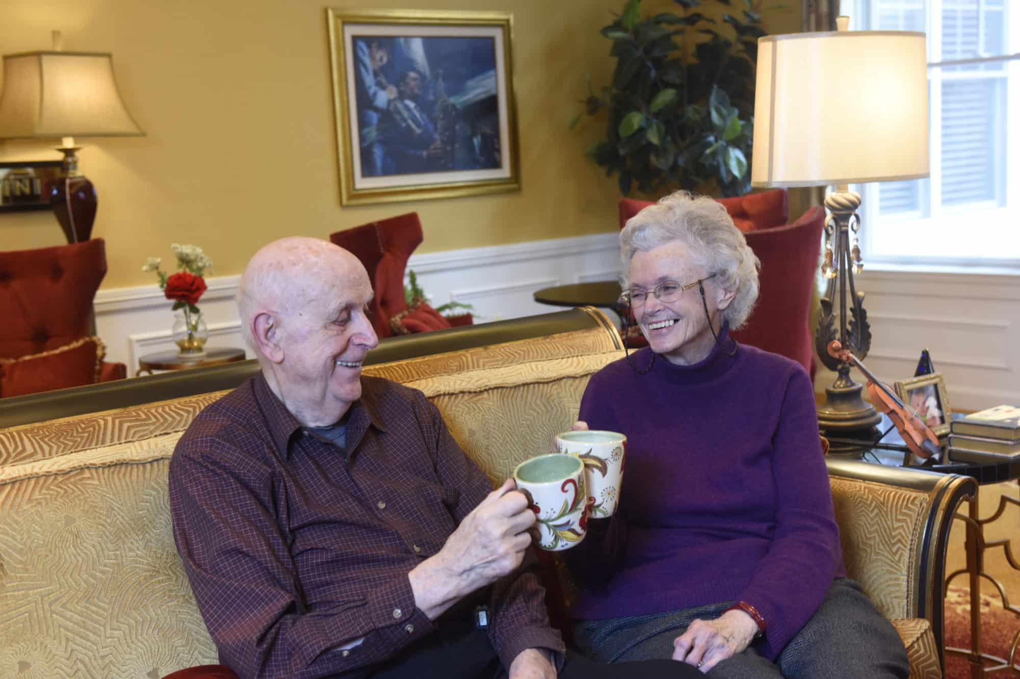 residents saying cheers with mugs