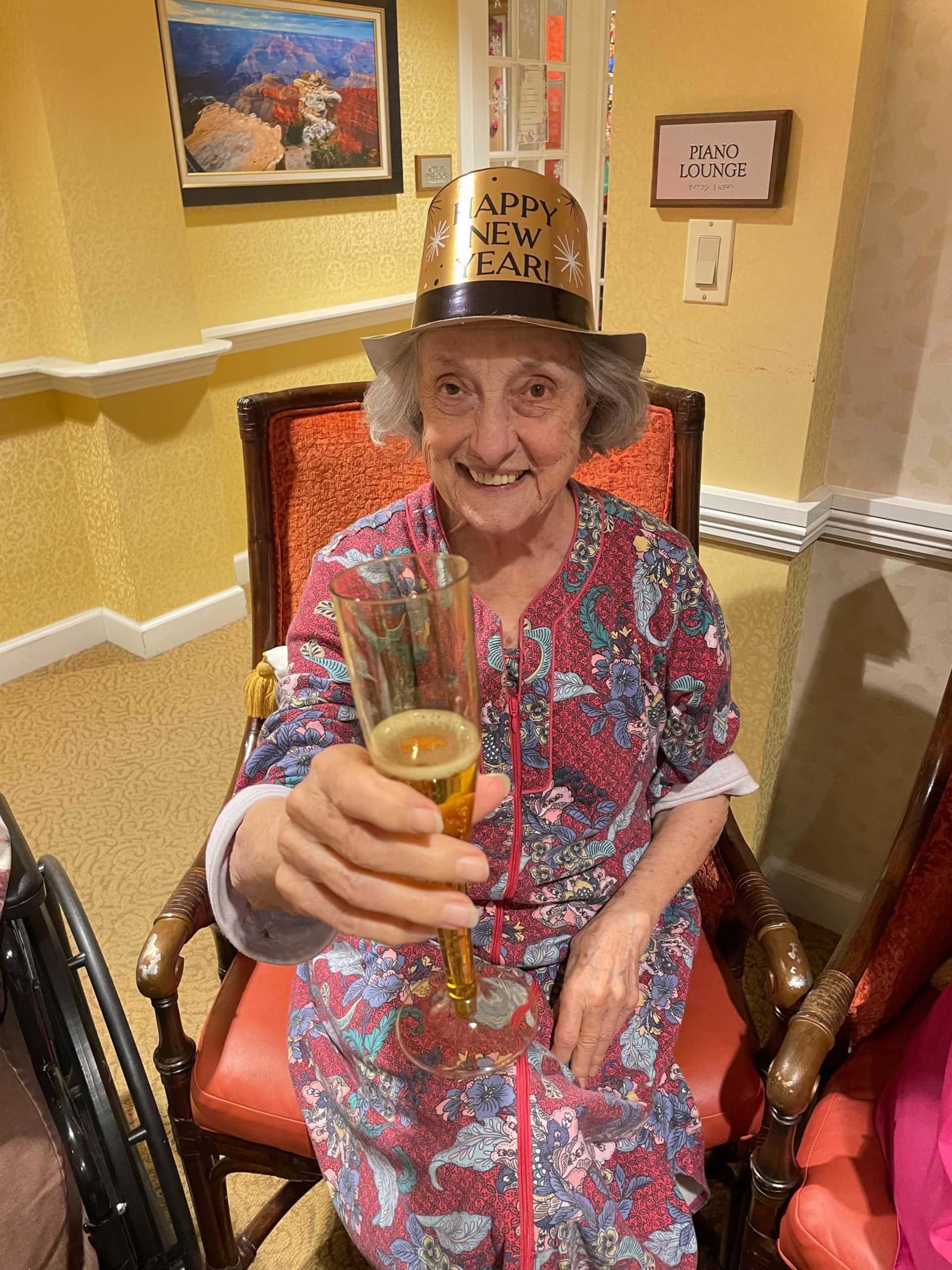 resident enjoying drink for New Years