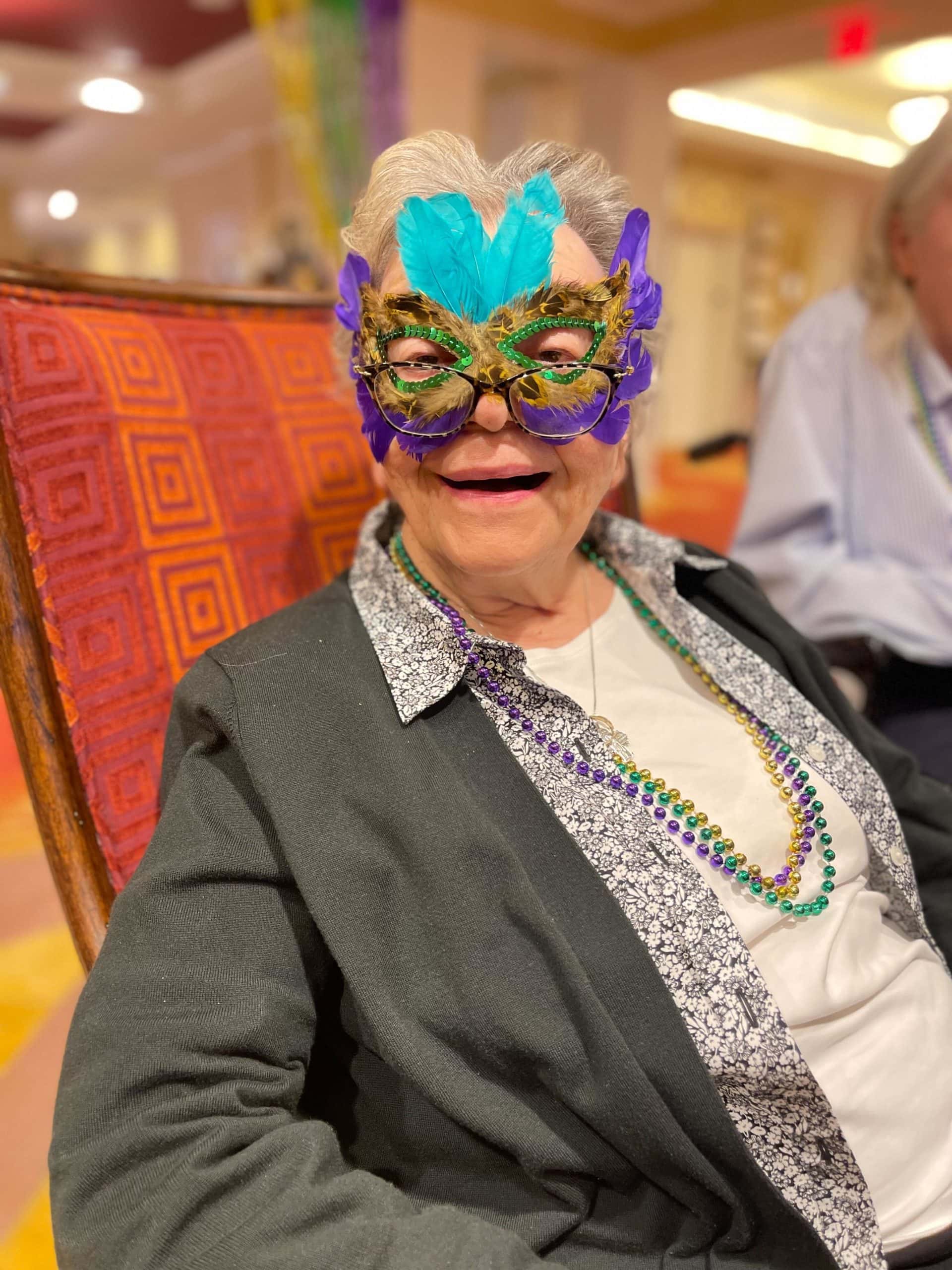 resident dressed for Mardi Gras