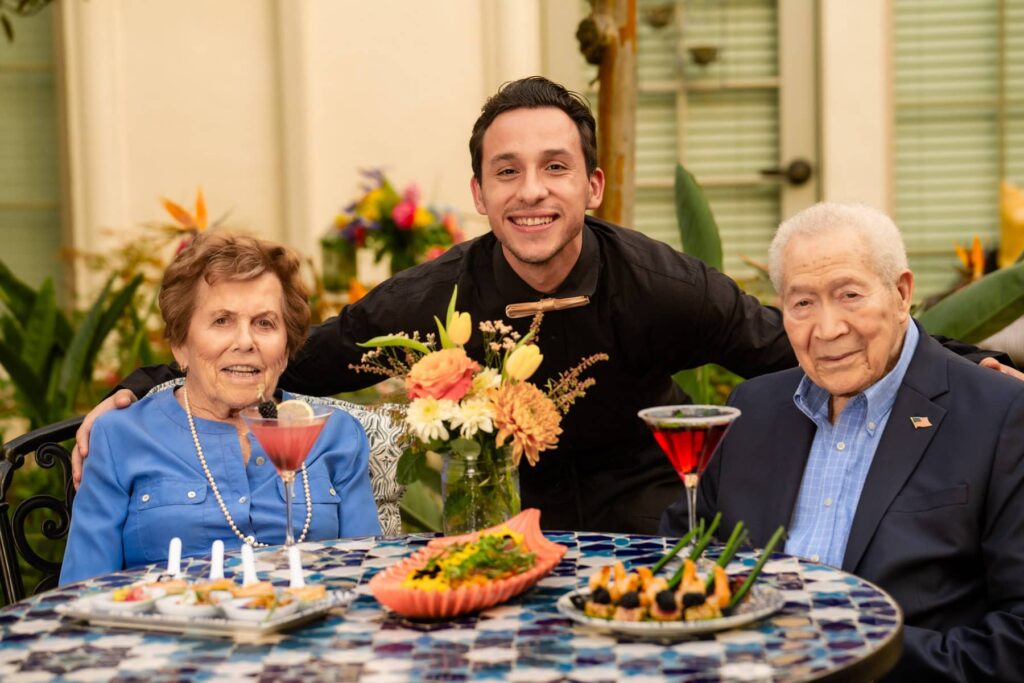 team member with residents dining