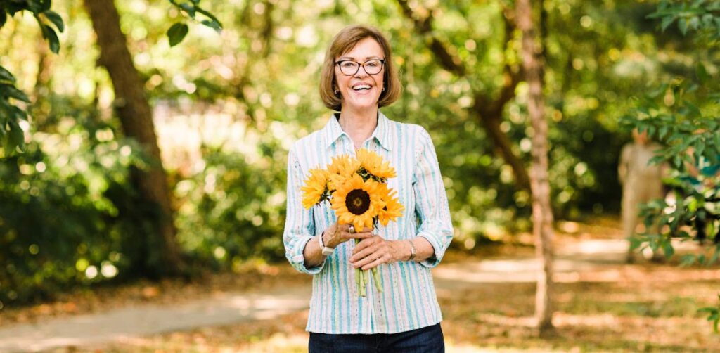 woman holding sunflowers
